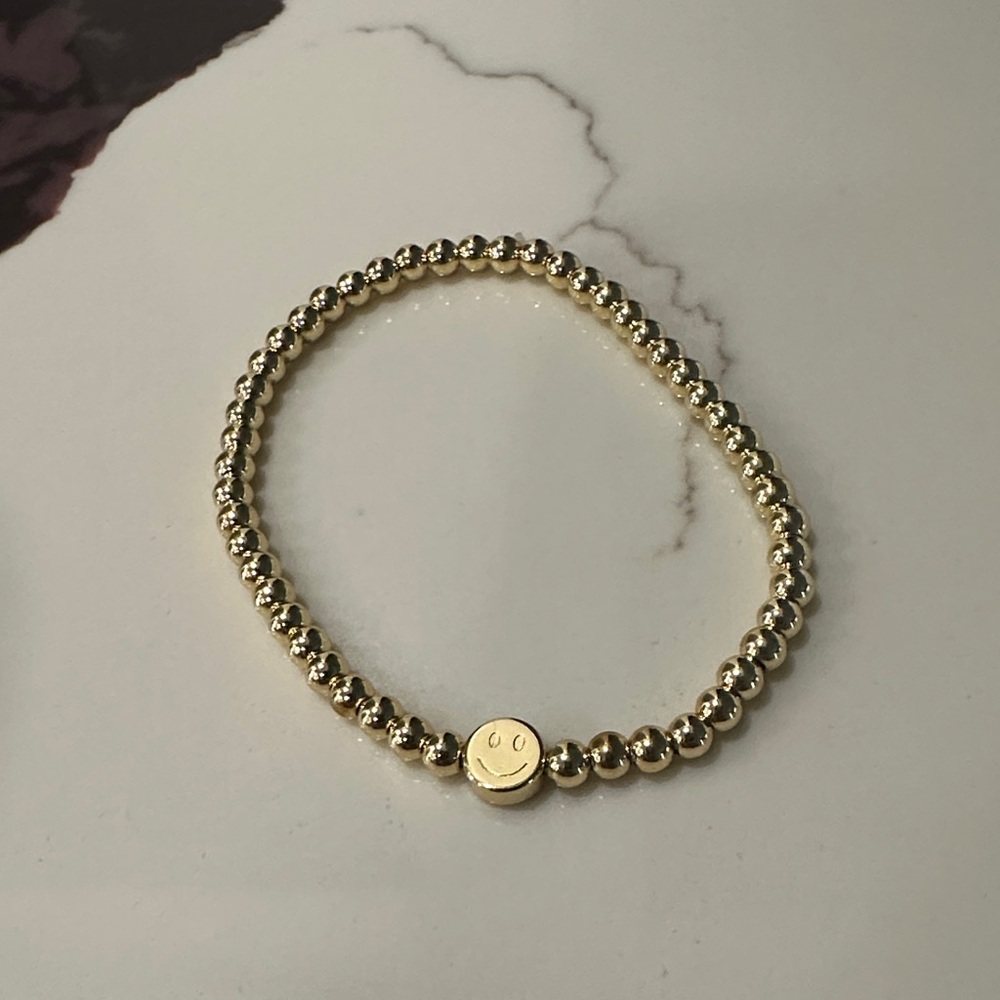Chic Gold Beaded Bracelet with Smiley Charm